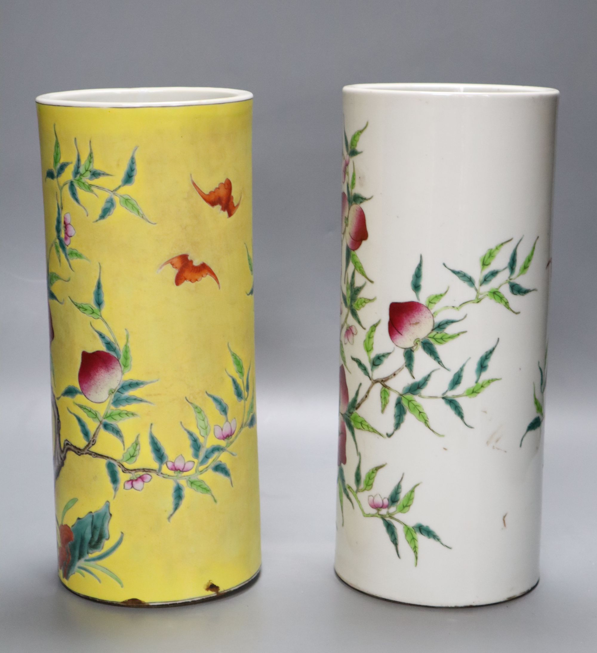 Two Chinese peaches and bats famille rose cylindrical vases, height 29cm